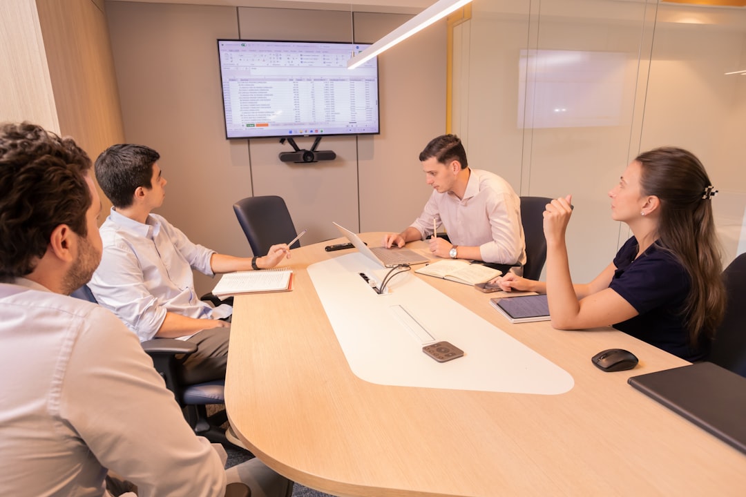 A B2B buying committee meeting around a boardroom table