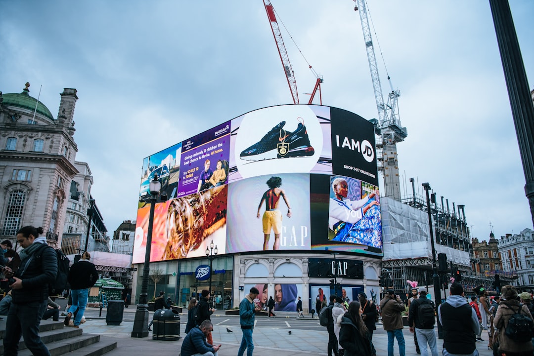 Illuminated digital advertising screens on a European city street