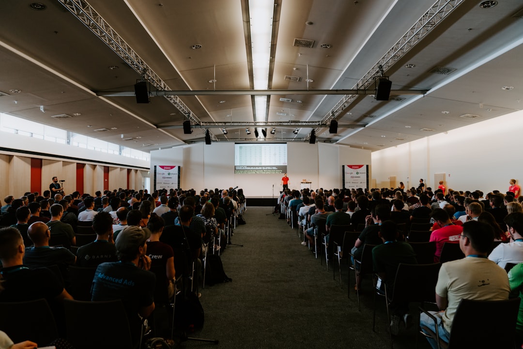 Audience seated in rows at a large B2B business conference